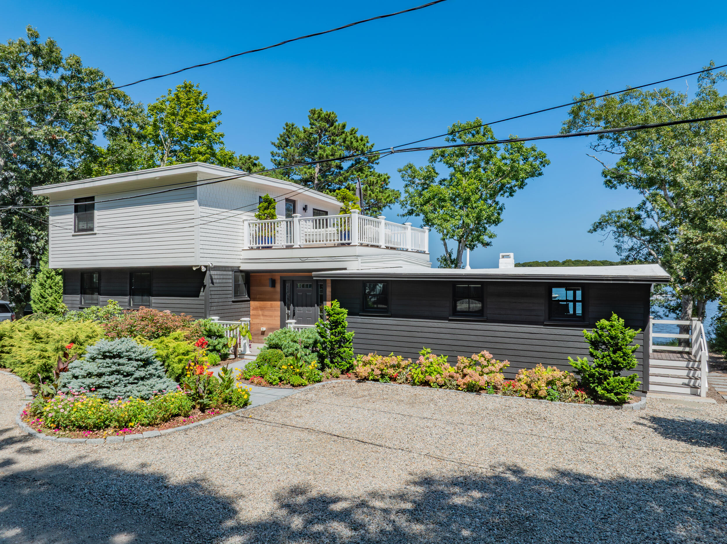 18 Great River Road Mashpee, MA 02649 - Photo 86 of 99 front view of a house with a yard