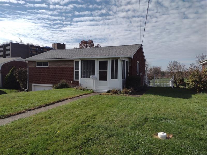 118 Sylvan Drive Lower Burrell, PA 15068 - Photo 2 of 14 front view of a house with a yard
