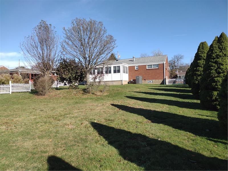 118 Sylvan Drive Lower Burrell, PA 15068 - Photo 3 of 14 a front view of a house with a yard