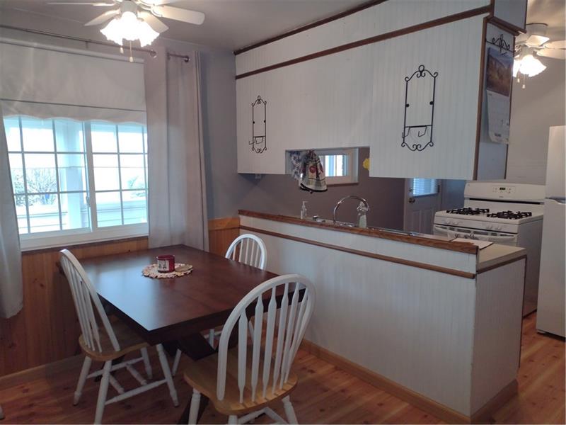 118 Sylvan Drive Lower Burrell, PA 15068 - Photo 6 of 14 a kitchen with a table chairs and a stove