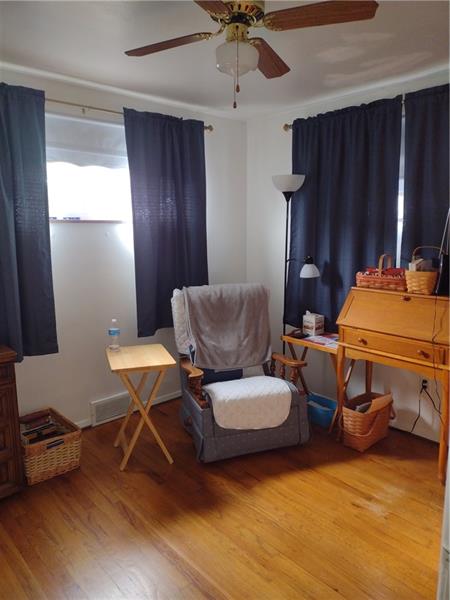 118 Sylvan Drive Lower Burrell, PA 15068 - Photo 10 of 14 a living room with furniture a ceiling fan and a window