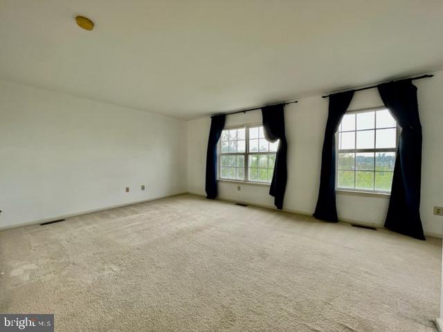 268 Ripka Street Philadelphia, PA 19127 - Photo 12 of 31 an empty room with windows and mirror