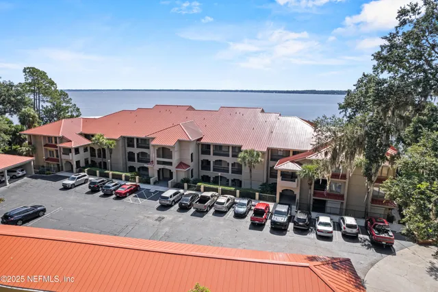 a view of a street with a table chairs and a fire pit