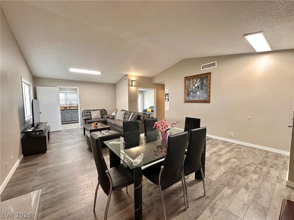 2340 Viewcrest Road Henderson, NV 89014 - Photo 7 of 36 This inviting space features durable flooring and an open flow for comfortable living and entertaining.