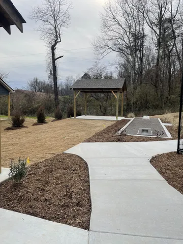 a view of a backyard of the house