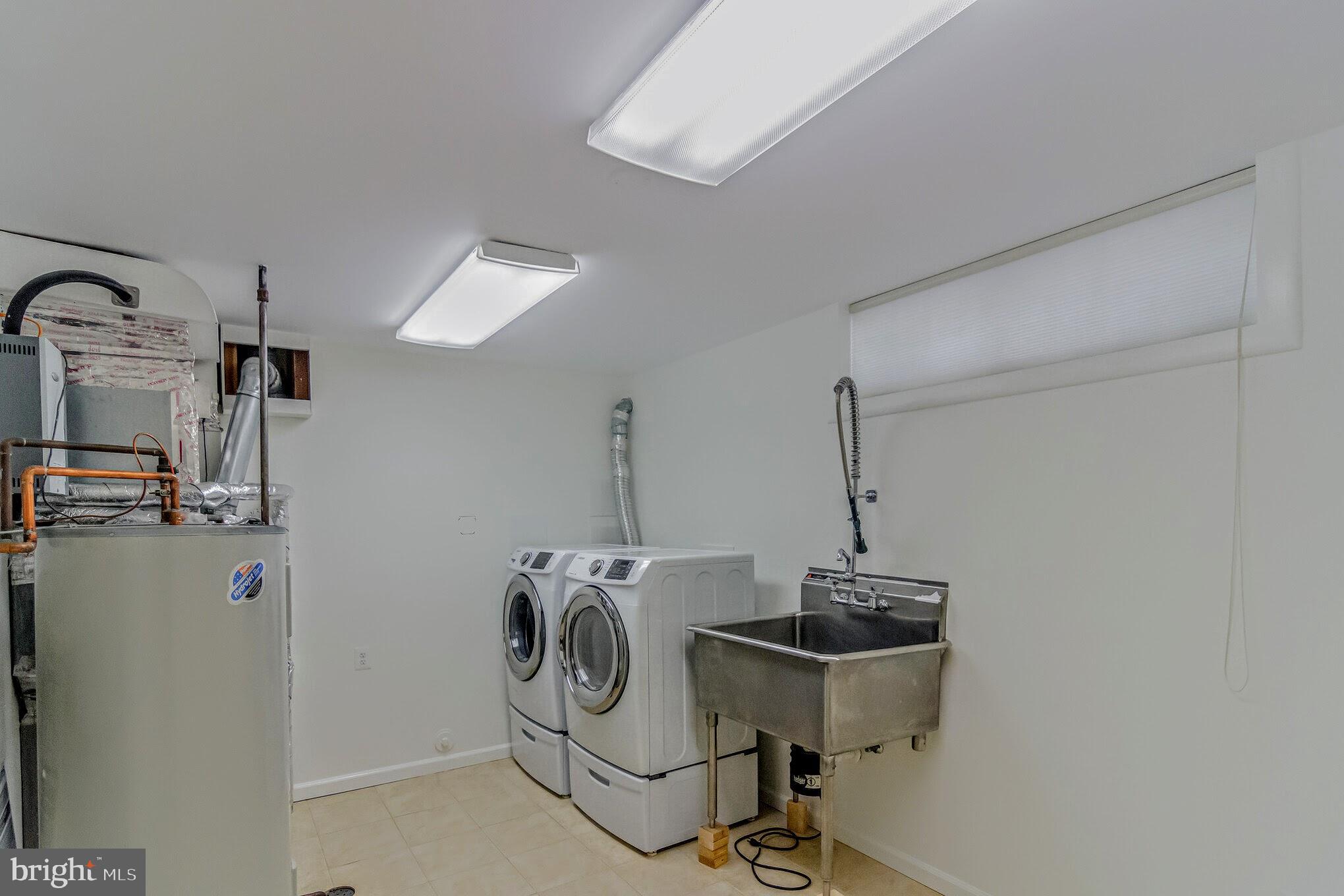 11503 Maple Ridge Road Reston, VA 20190 - Photo 12 of 94 Utility room front loaders W/D and SS Sink