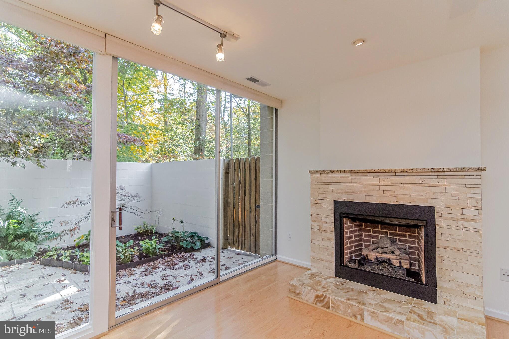 11503 Maple Ridge Road Reston, VA 20190 - Photo 14 of 94 Gas fireplace w/stone front, marble hearth