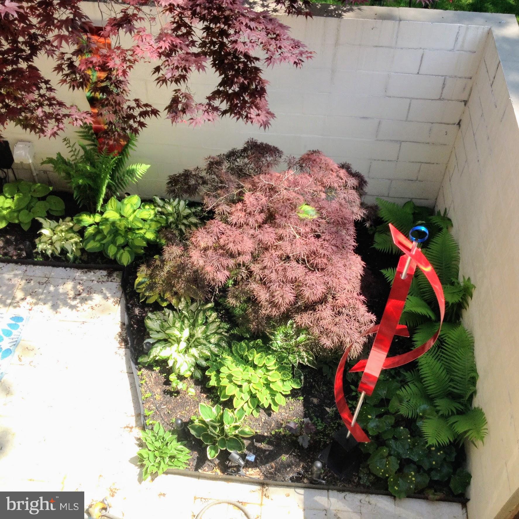 11503 Maple Ridge Road Reston, VA 20190 - Photo 34 of 94 Window view overlooking patio garden