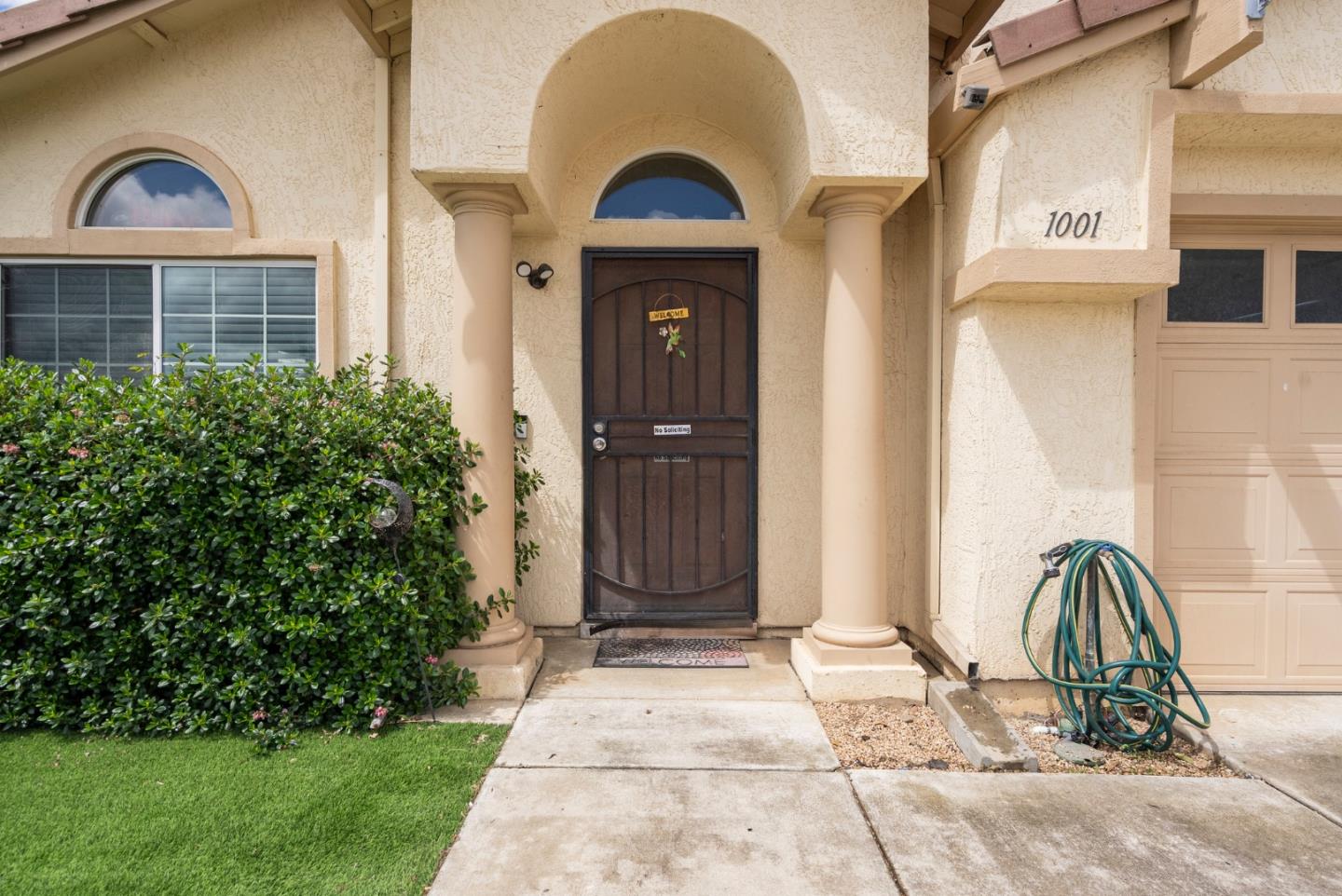 1001 Eagle Drive Salinas, CA 93905 - Photo 3 of 39 a view of a brick house with a large door and a large window