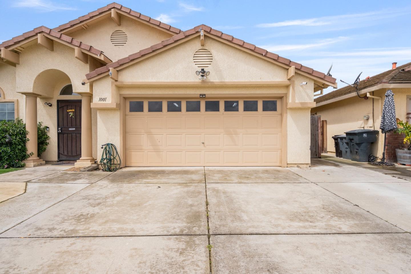 1001 Eagle Drive Salinas, CA 93905 - Photo 4 of 39 a front view of a house with a yard and garage