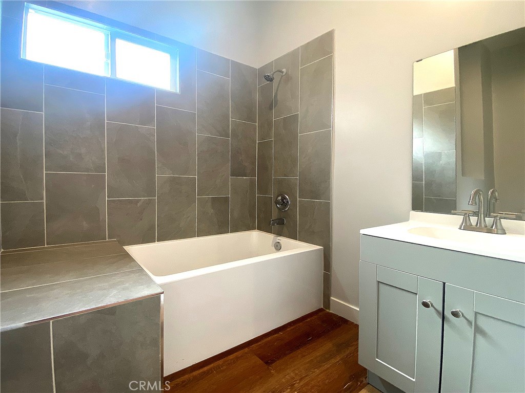 300 East Alhambra Road, Unit D Alhambra, CA 91801 - Photo 19 of 26 a bathroom with a tub a sink and mirror