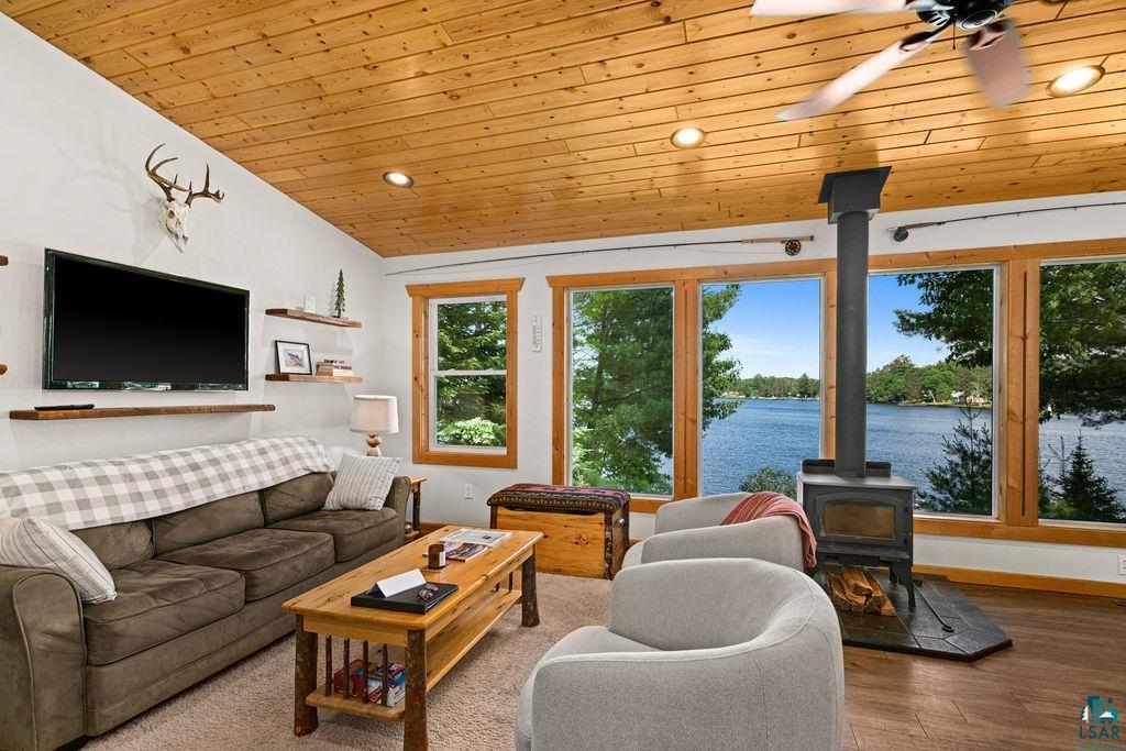 7338 South Maranatha Road Lake Nebagamon, WI 54849 - Photo 21 of 41 Vaulted ceiling with wood-finish paneling, recessed lighting, and ceiling fan
