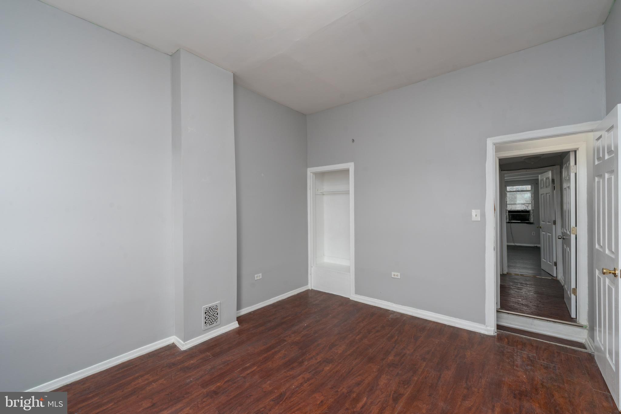 430 South Payson Street Baltimore, MD 21223 - Photo 18 of 29 a view of an empty room with wooden floor and closet