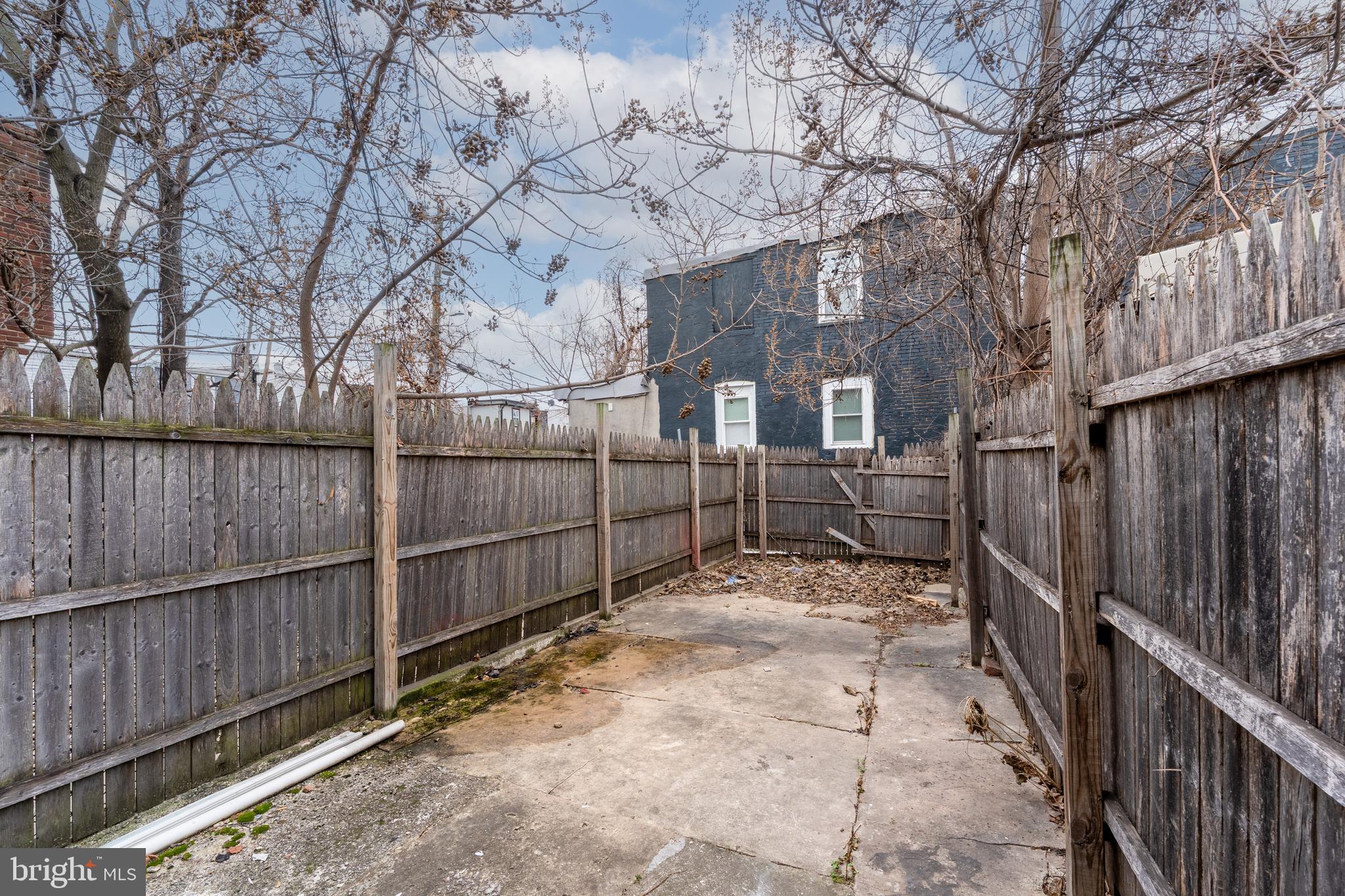 430 South Payson Street Baltimore, MD 21223 - Photo 29 of 29 a view of a yard with wooden fence
