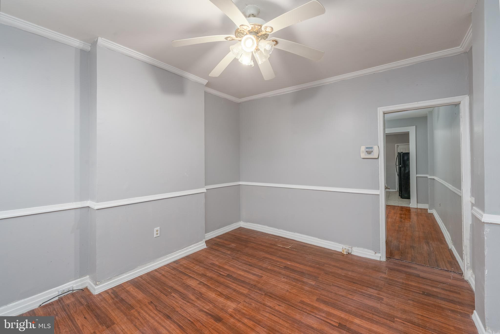 430 South Payson Street Baltimore, MD 21223 - Photo 7 of 29 a view of an empty room with wooden floor