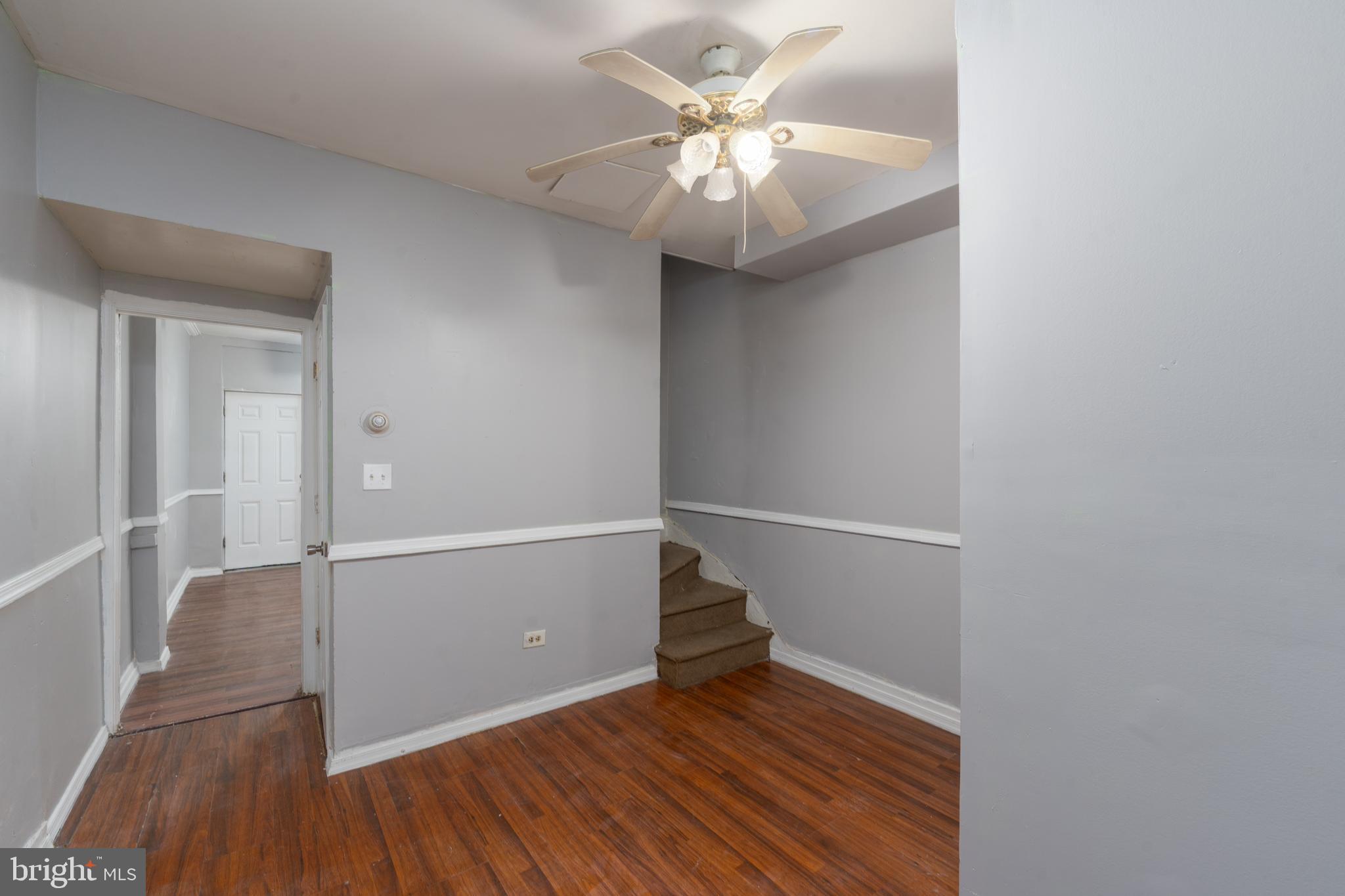 430 South Payson Street Baltimore, MD 21223 - Photo 8 of 29 wooden floor in an empty room with a window