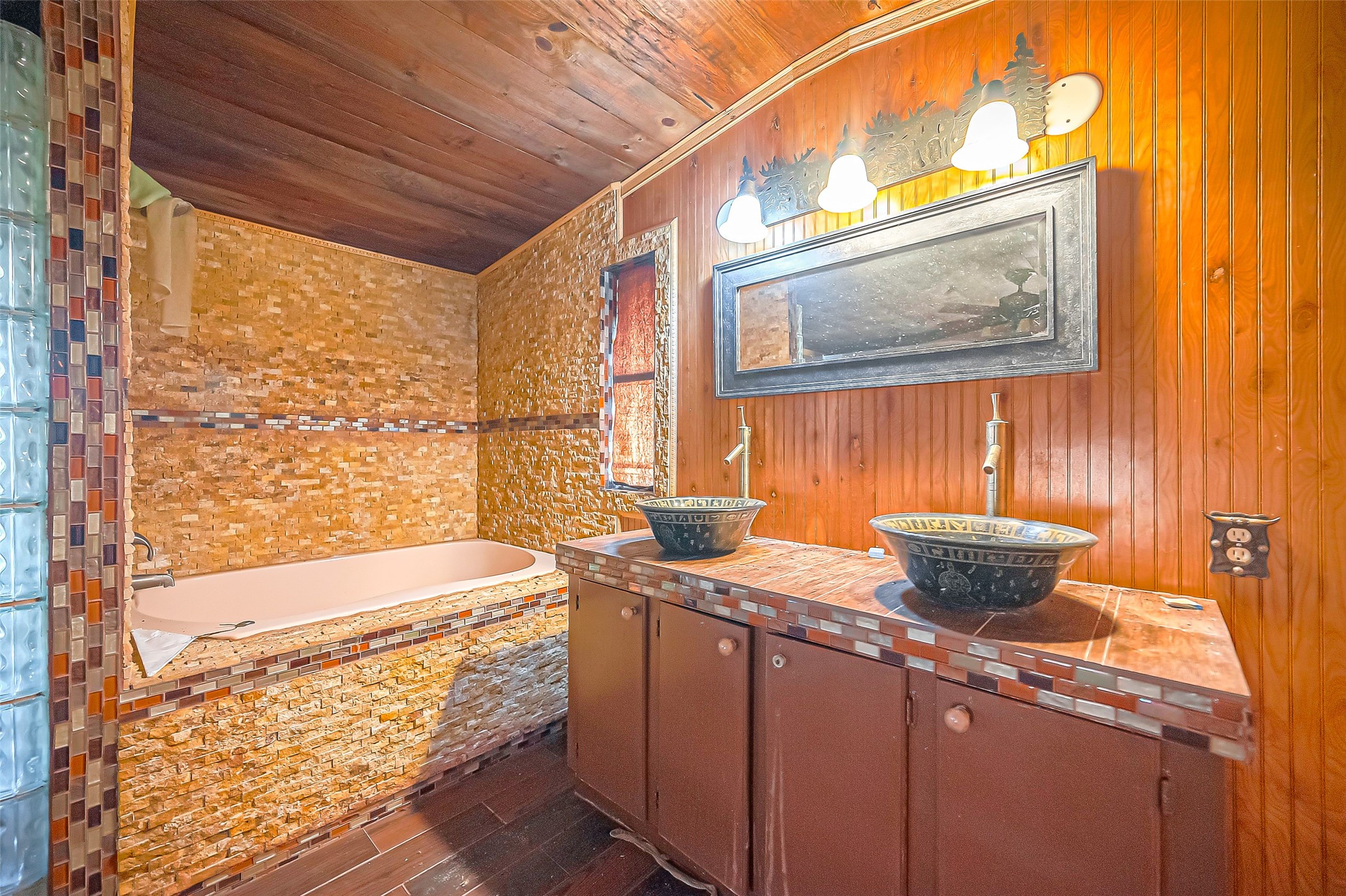2830 County Road 290 Angleton, TX 77515 - Photo 11 of 11 a bathroom with a granite countertop sink mirror and a bathtub