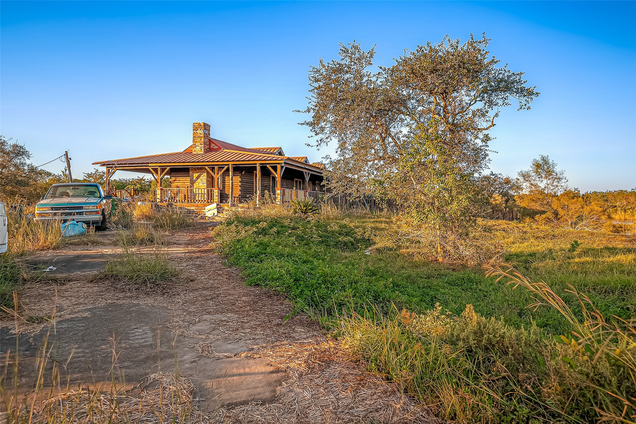 2830 County Road 290 Angleton, TX 77515 - Photo 3 of 11 a front view of a house with a yard