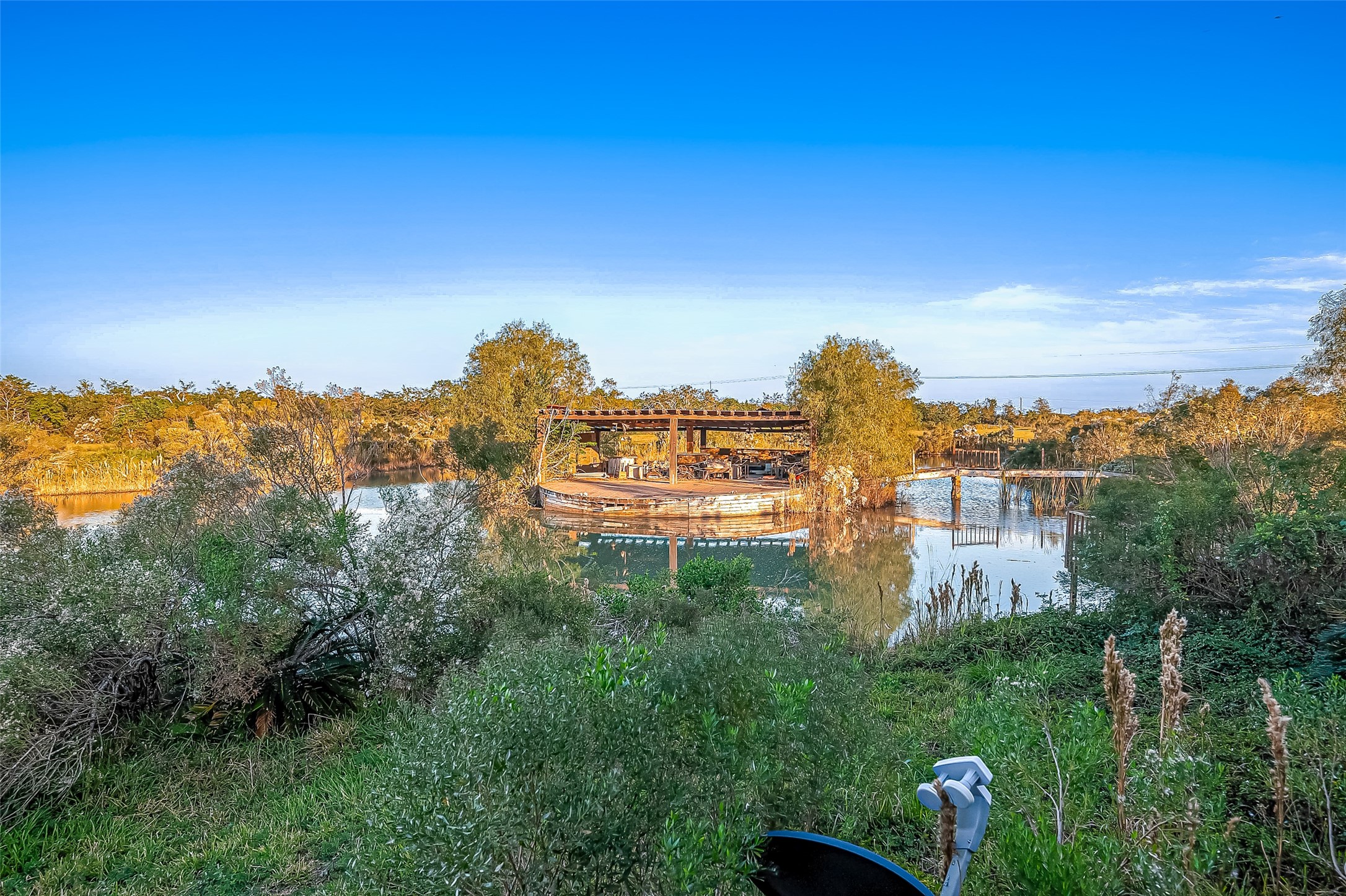 2830 County Road 290 Angleton, TX 77515 - Photo 5 of 11 a view of a lake with houses in back