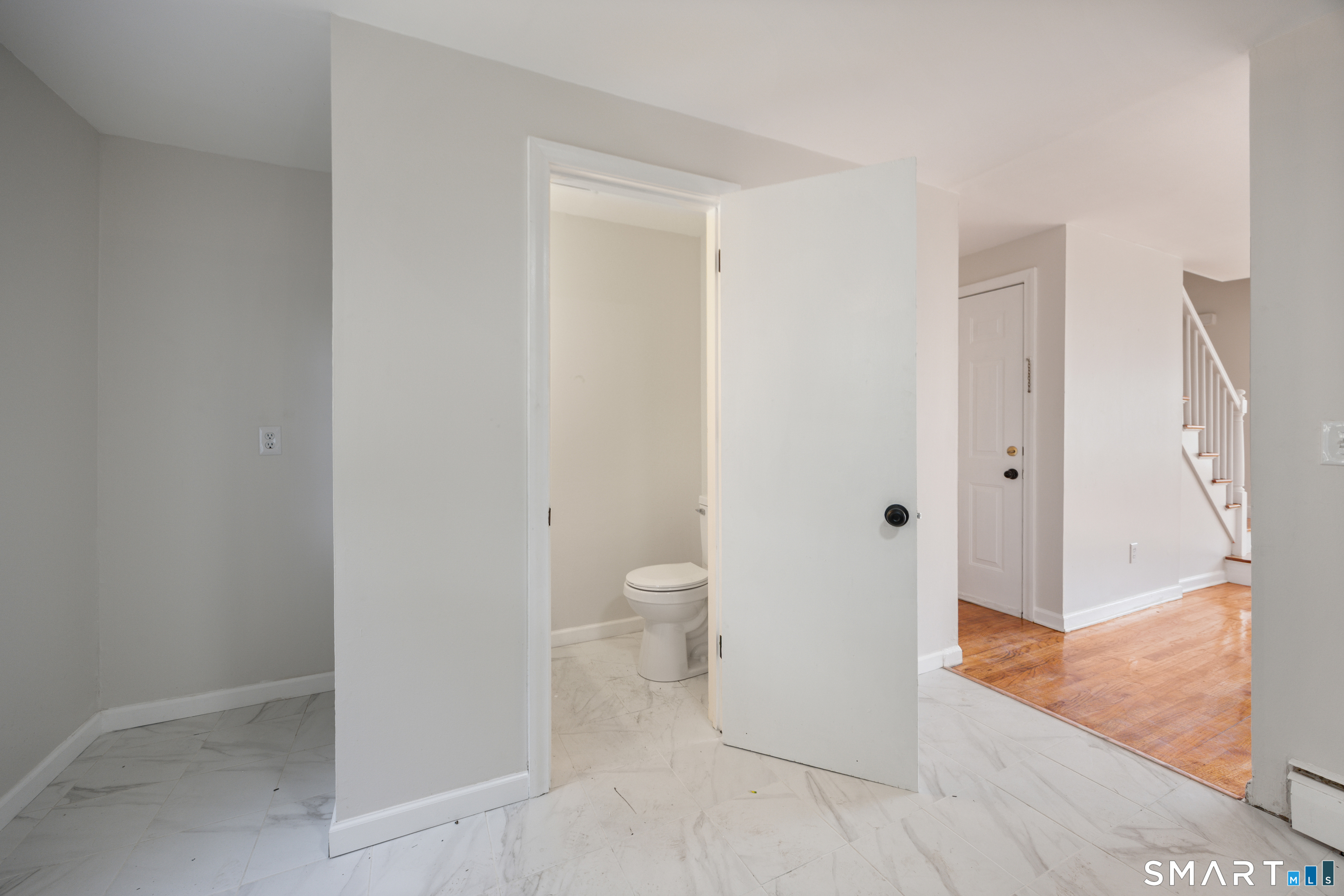 12 Lewis Road New Britain, CT 06053 - Photo 11 of 31 Half bath on first level off the kitchen