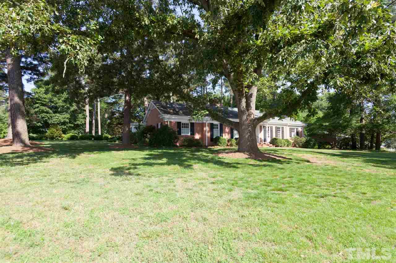 2401 Ridge Road Raleigh, NC 27612 - Photo 2 of 24 a view of a house with a yard