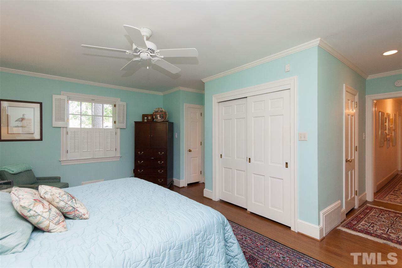 2401 Ridge Road Raleigh, NC 27612 - Photo 14 of 24 a bedroom with a bed and a window