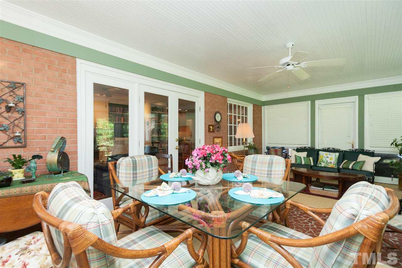2401 Ridge Road Raleigh, NC 27612 - Photo 20 of 24 a view of a dining room with furniture window and outside view