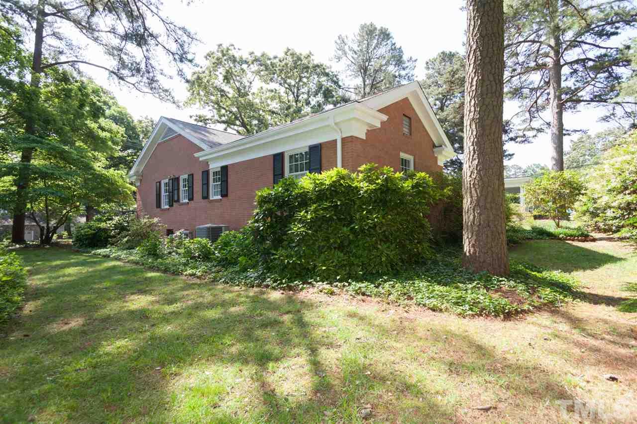 2401 Ridge Road Raleigh, NC 27612 - Photo 22 of 24 a front view of house with yard and green space
