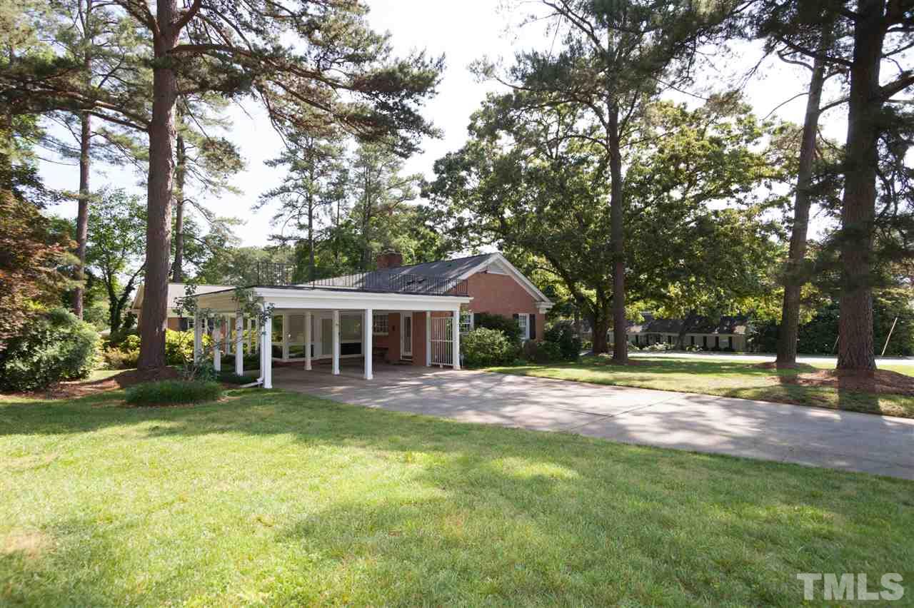 2401 Ridge Road Raleigh, NC 27612 - Photo 24 of 24 a front view of a house with a garden