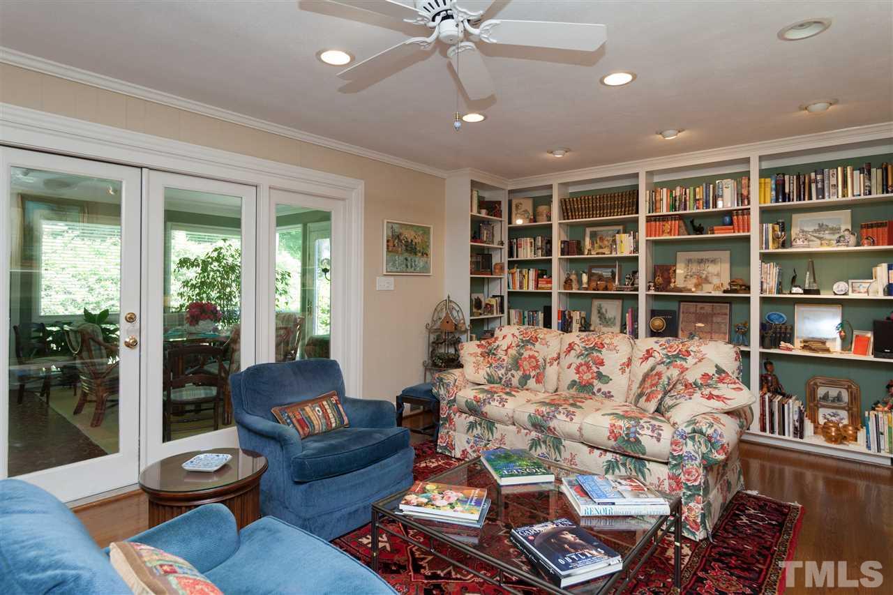 2401 Ridge Road Raleigh, NC 27612 - Photo 9 of 24 a living room with furniture and a book shelf