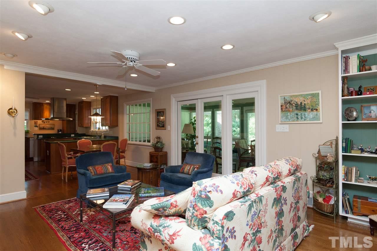 2401 Ridge Road Raleigh, NC 27612 - Photo 10 of 24 a living room with furniture and a book shelf