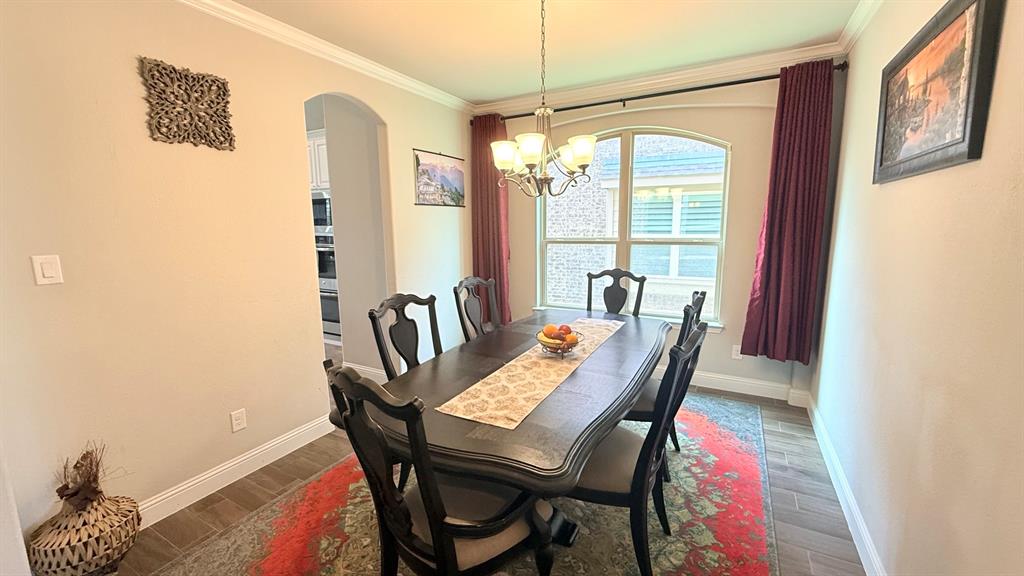 337 Prairie Ridge Lane Lewisville, TX 75056 - Photo 5 of 28 a view of a dining room with furniture window and outside view