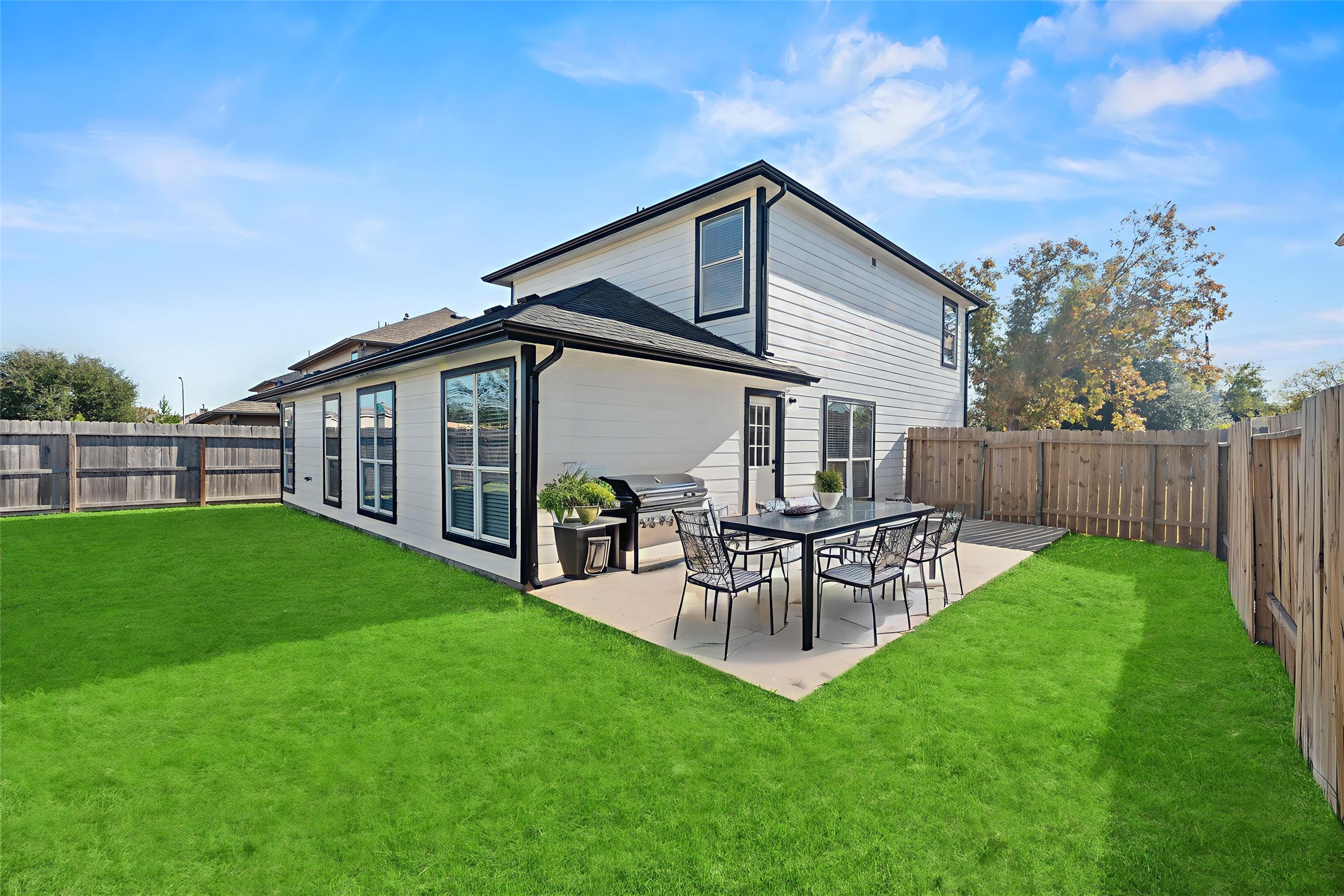 19910 Rustic Lake Lane Cypress, TX 77433 - Photo 15 of 21 Step out and discover the fully fenced backyard, offering a wonderful green space for outdoor activities and relaxation. Virtually staged.