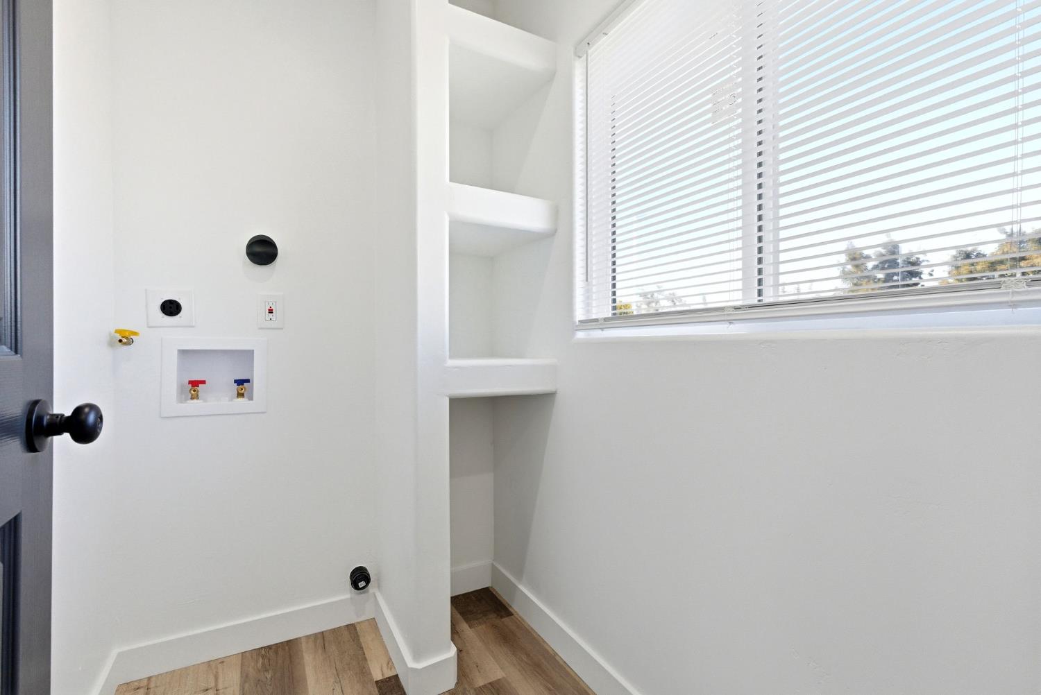 3763 East Verrue Avenue Fresno, CA 93702 - Photo 13 of 24 a bathroom with a window and shower