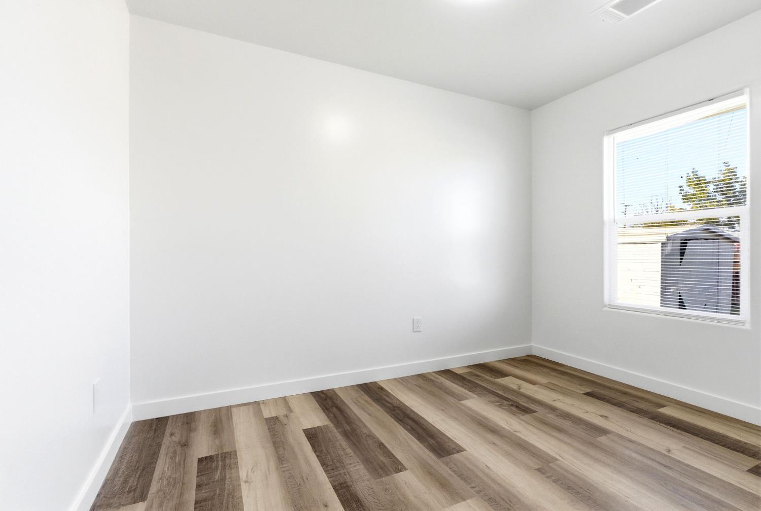3763 East Verrue Avenue Fresno, CA 93702 - Photo 19 of 24 a view of a room that has a window
