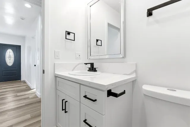 a bathroom with a sink a toilet and a bathtub