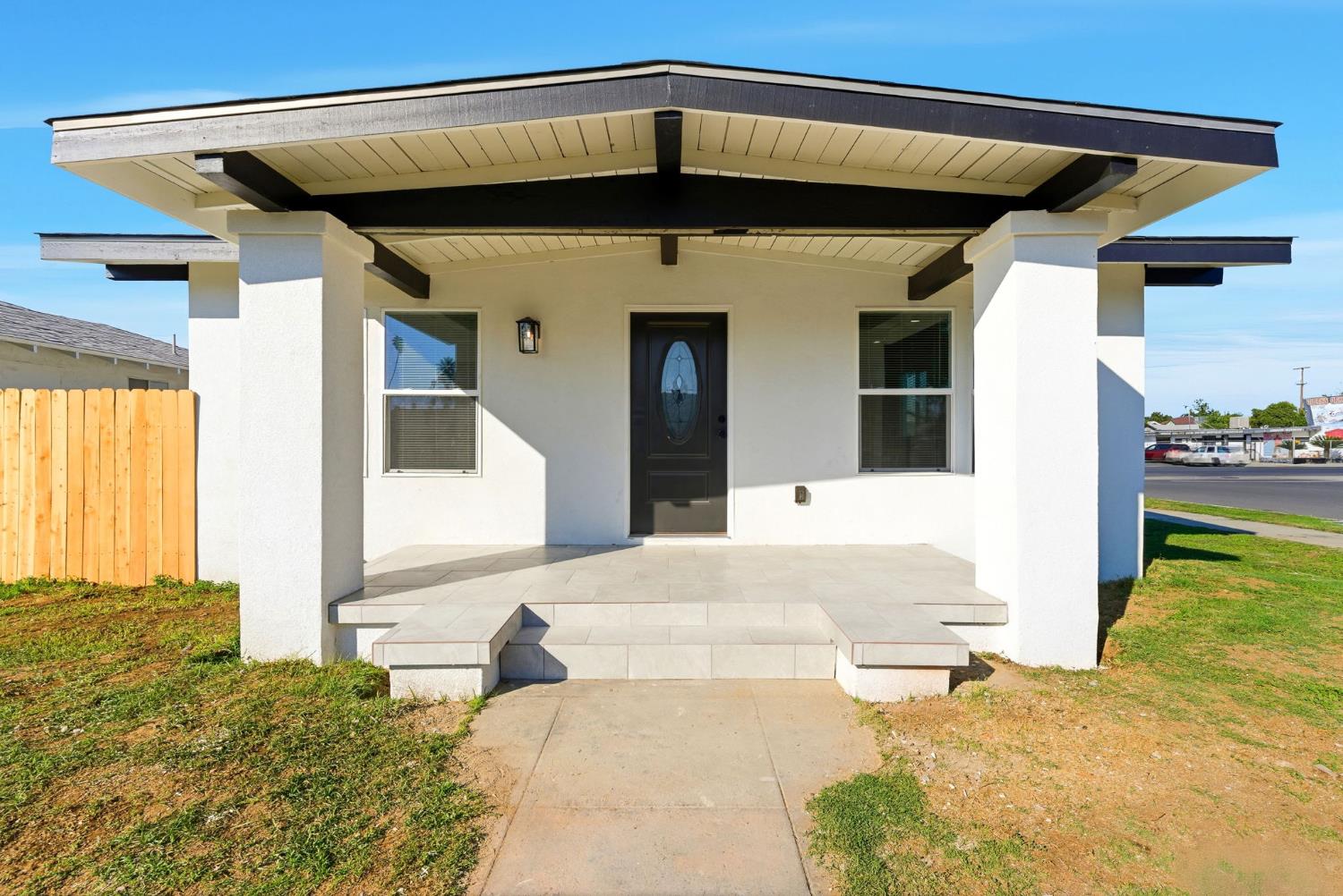 3763 East Verrue Avenue Fresno, CA 93702 - Photo 2 of 24 a front view of a house with a yard
