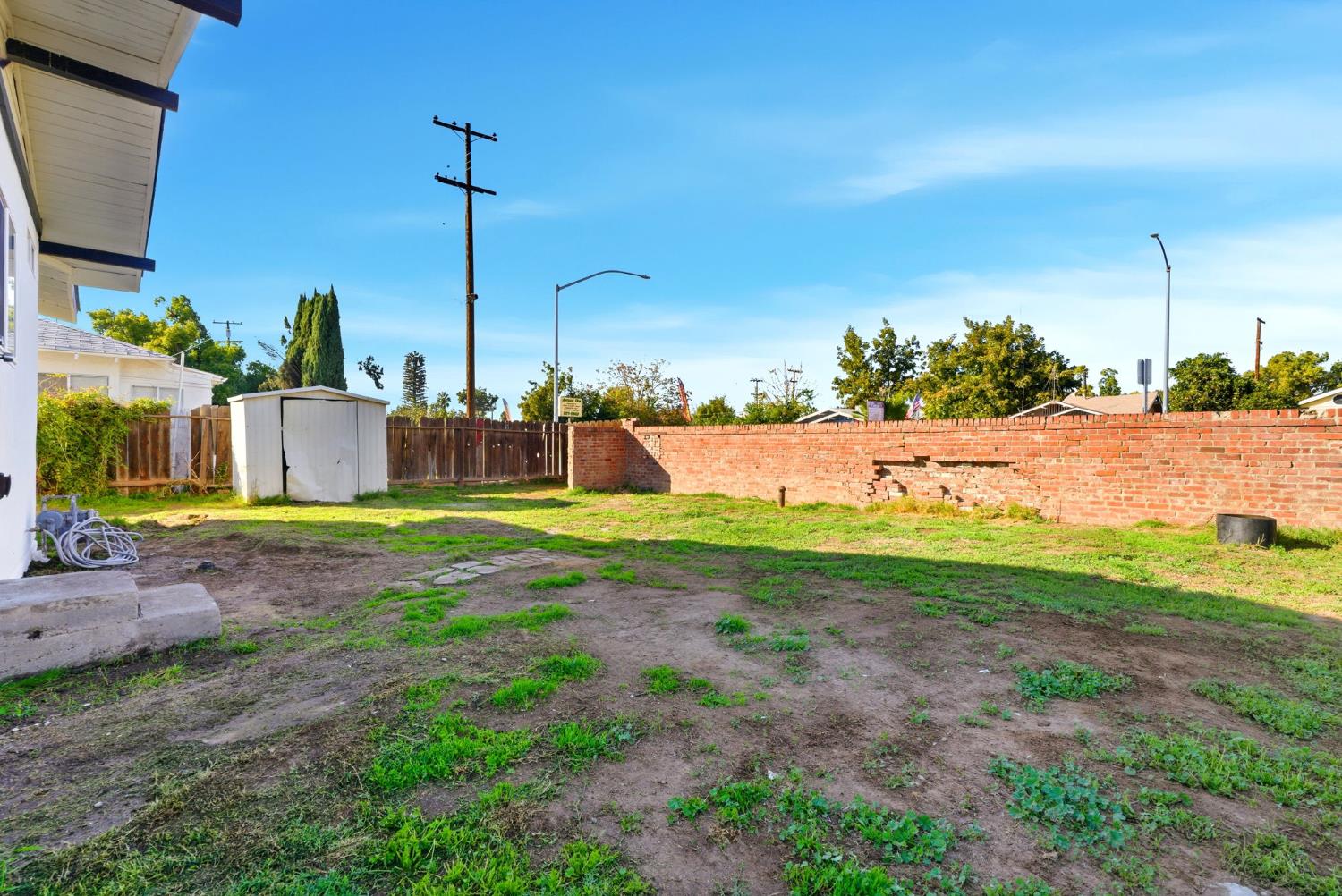 3763 East Verrue Avenue Fresno, CA 93702 - Photo 23 of 24 a view of a house with a yard