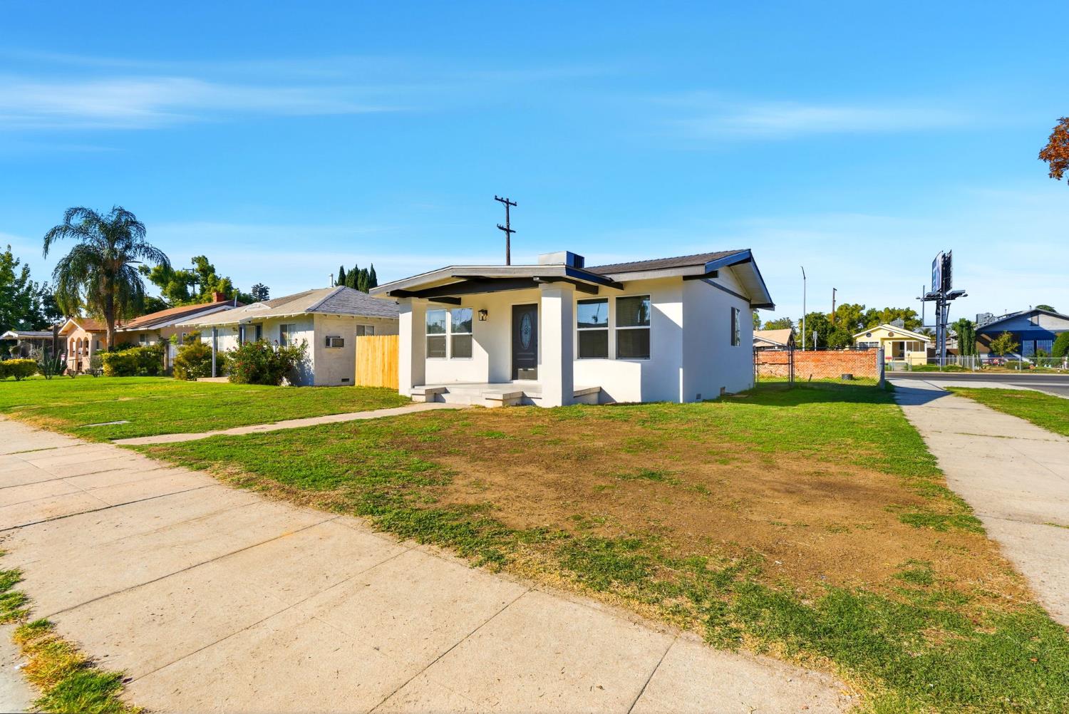 3763 East Verrue Avenue Fresno, CA 93702 - Photo 4 of 24 a front view of a house with a yard