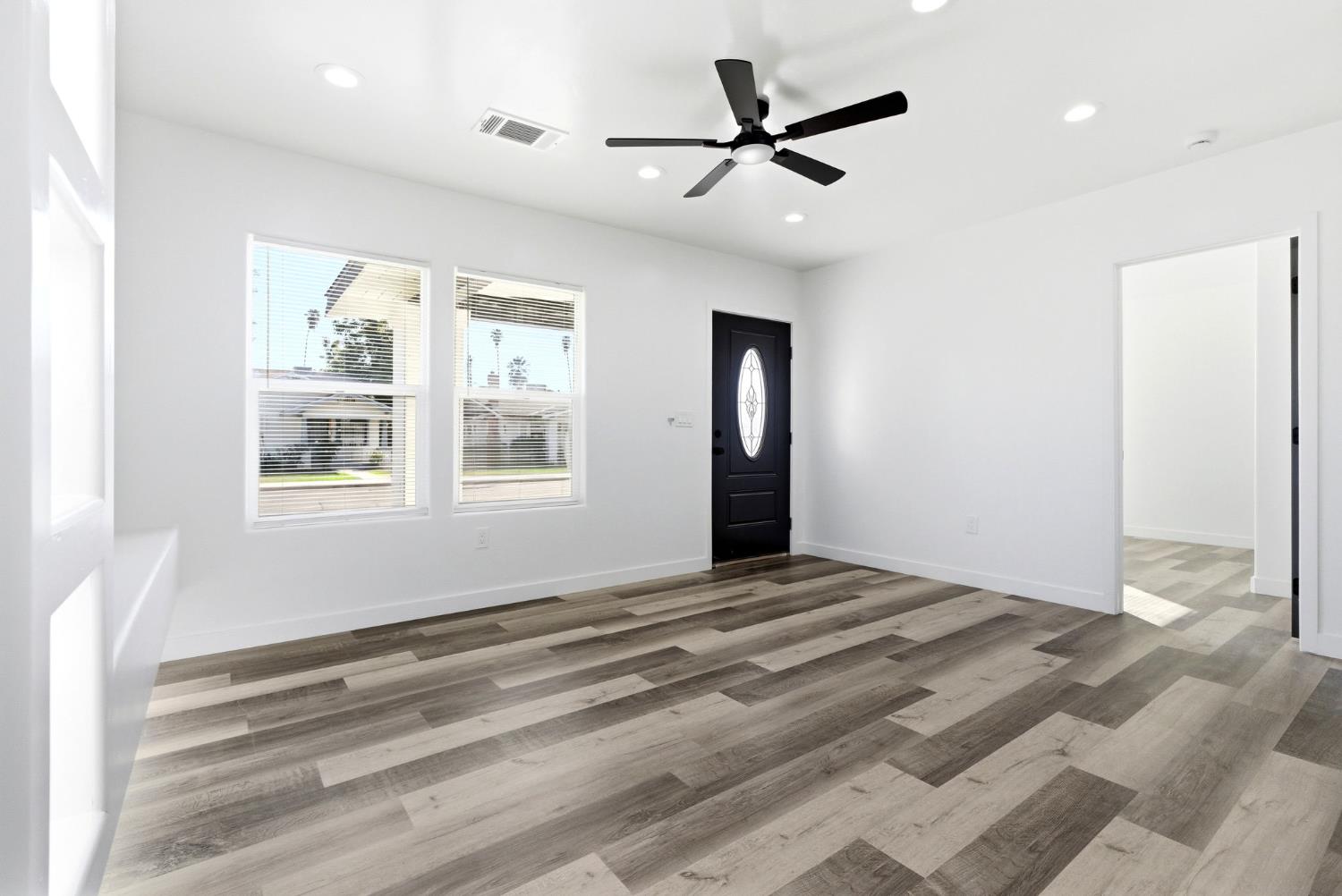 3763 East Verrue Avenue Fresno, CA 93702 - Photo 6 of 24 a view of an empty room with a window