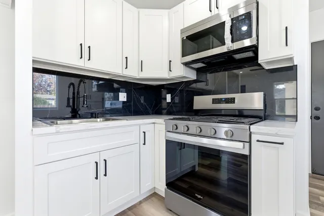 a view of a kitchen cabinets and a room