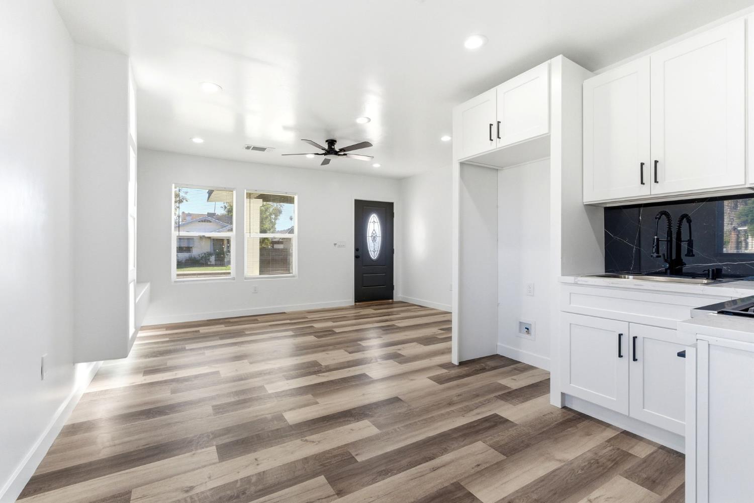 3763 East Verrue Avenue Fresno, CA 93702 - Photo 9 of 24 a view of a kitchen cabinets and a room