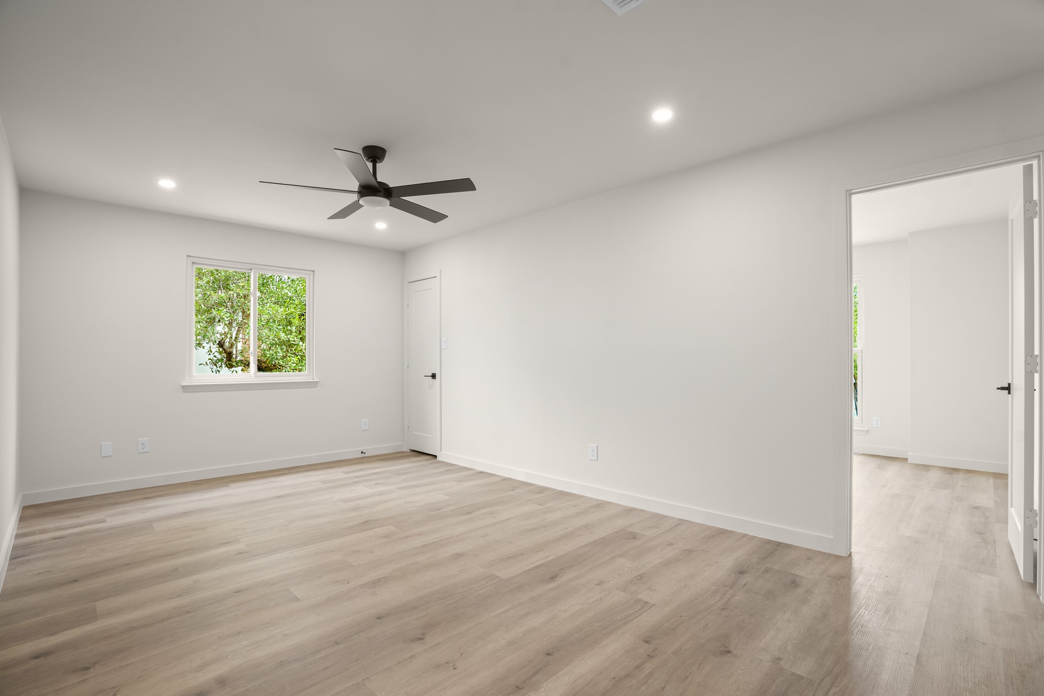 7826 Wheel Rim Circle Austin, TX 78749 - Photo 19 of 38 Gleaming hardwood floors and recessed lighting enhance this versatile bedroom space.