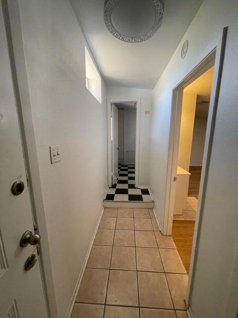 207 West 39th Street, Unit B Austin, TX 78751 - Photo 8 of 20 a view of a bathroom with a sink and a mirror