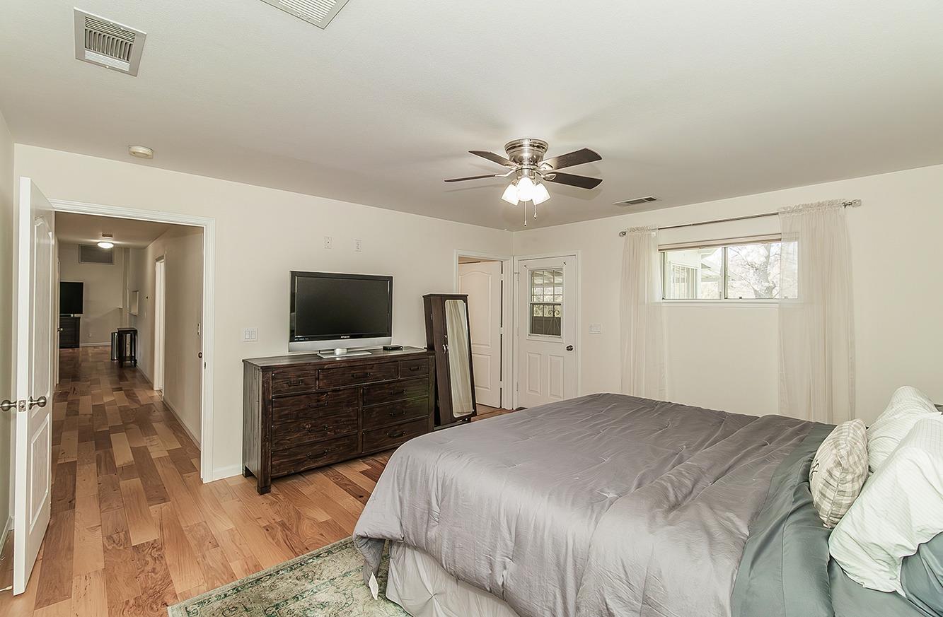 29039 Auberry Road Prather, CA 93651 - Photo 16 of 73 a bedroom with a bed and a flat screen tv