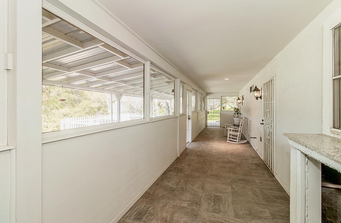 29039 Auberry Road Prather, CA 93651 - Photo 64 of 73 a view of a hallway with wooden floor and staircase