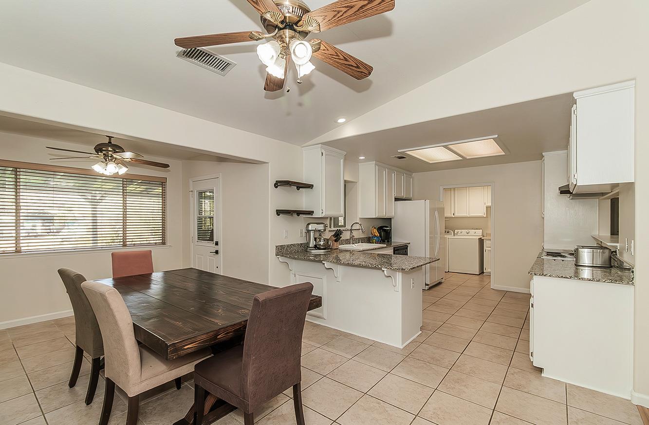29039 Auberry Road Prather, CA 93651 - Photo 9 of 73 a view of a dining room with furniture and a chandelier