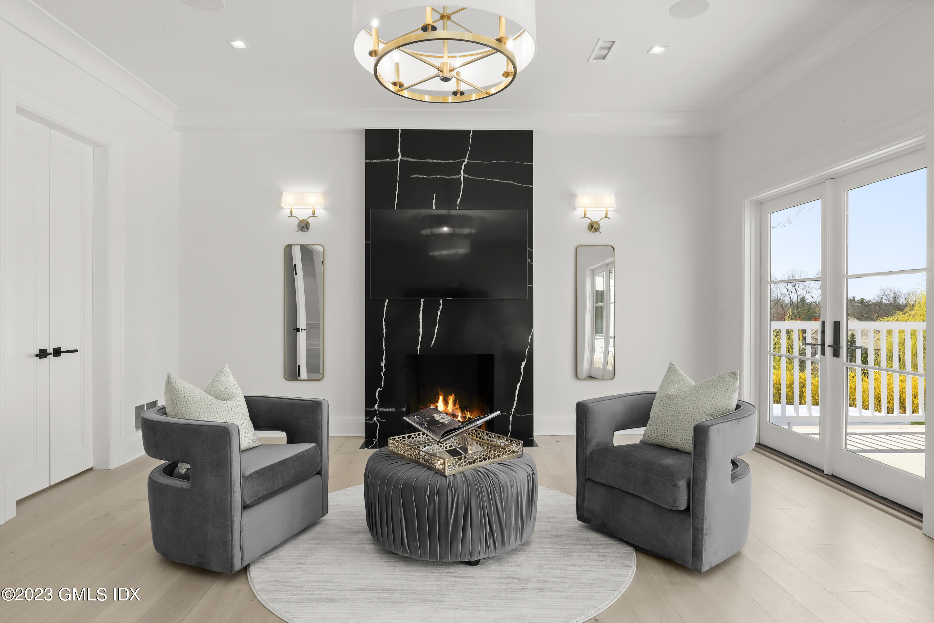 32 Meadowcroft Lane Greenwich, CT 06830 - Photo 13 of 43 a living room with furniture and a large window