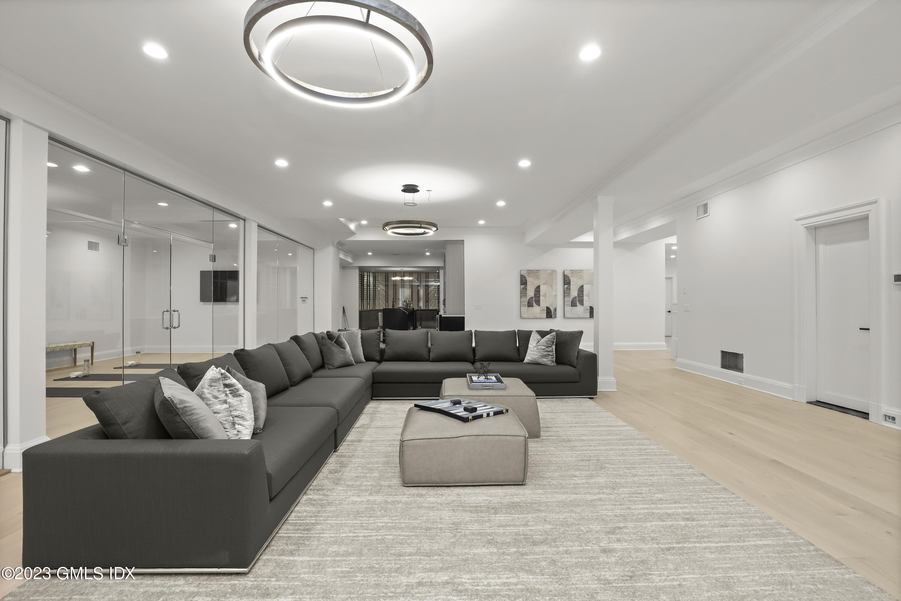 32 Meadowcroft Lane Greenwich, CT 06830 - Photo 30 of 43 a living room with furniture and a large window