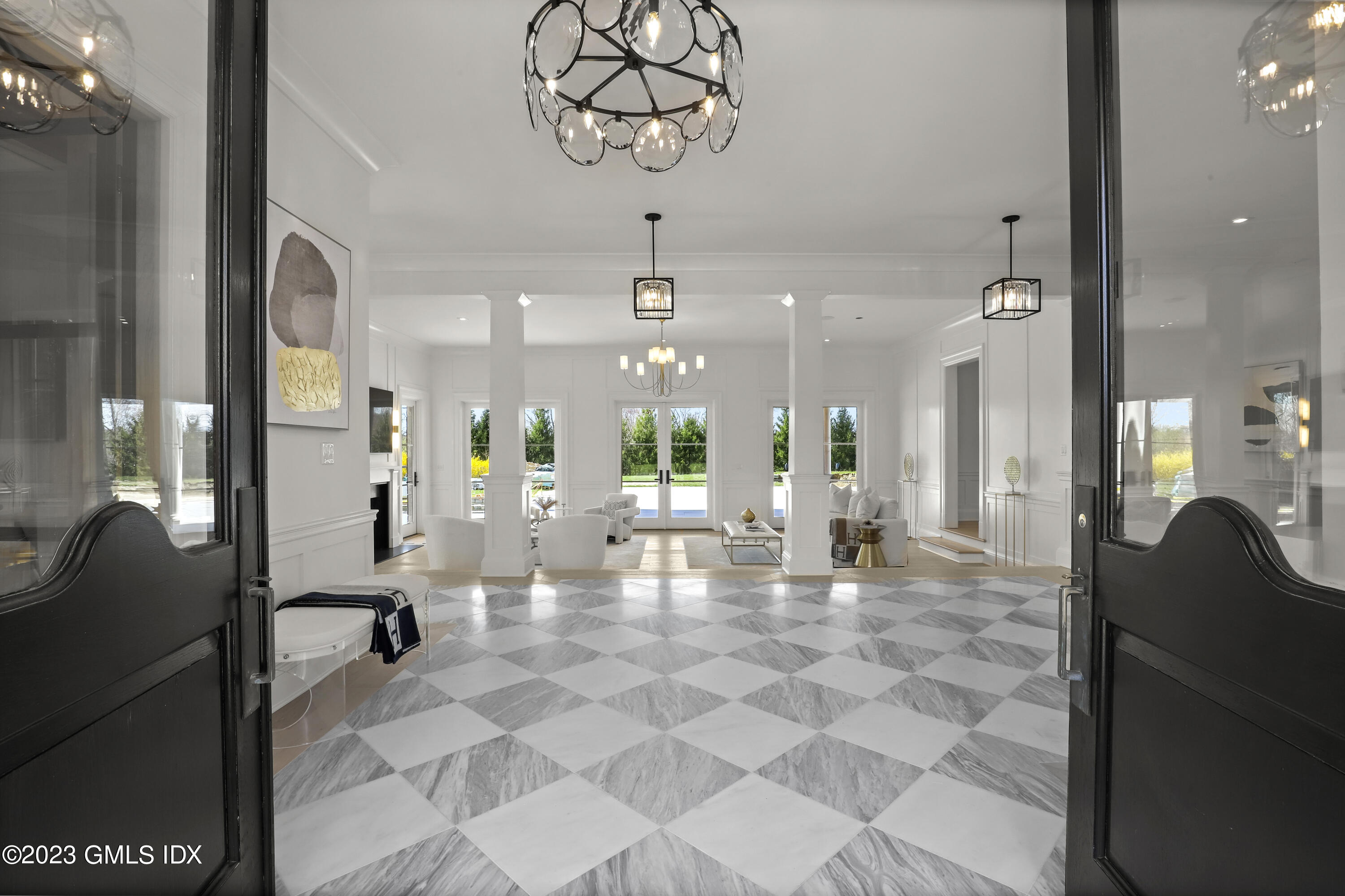 32 Meadowcroft Lane Greenwich, CT 06830 - Photo 3 of 43 a view of a lobby with a table and chairs